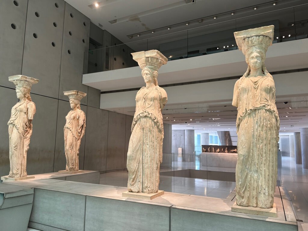 The Caryatids statues at the Acropolis Museum—female figures that once supported the Erechtheion Temple in Athens