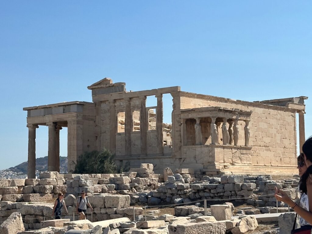 Erechtheion Temple on the Acropolis, featuring the Caryatid porch and classical ruins.