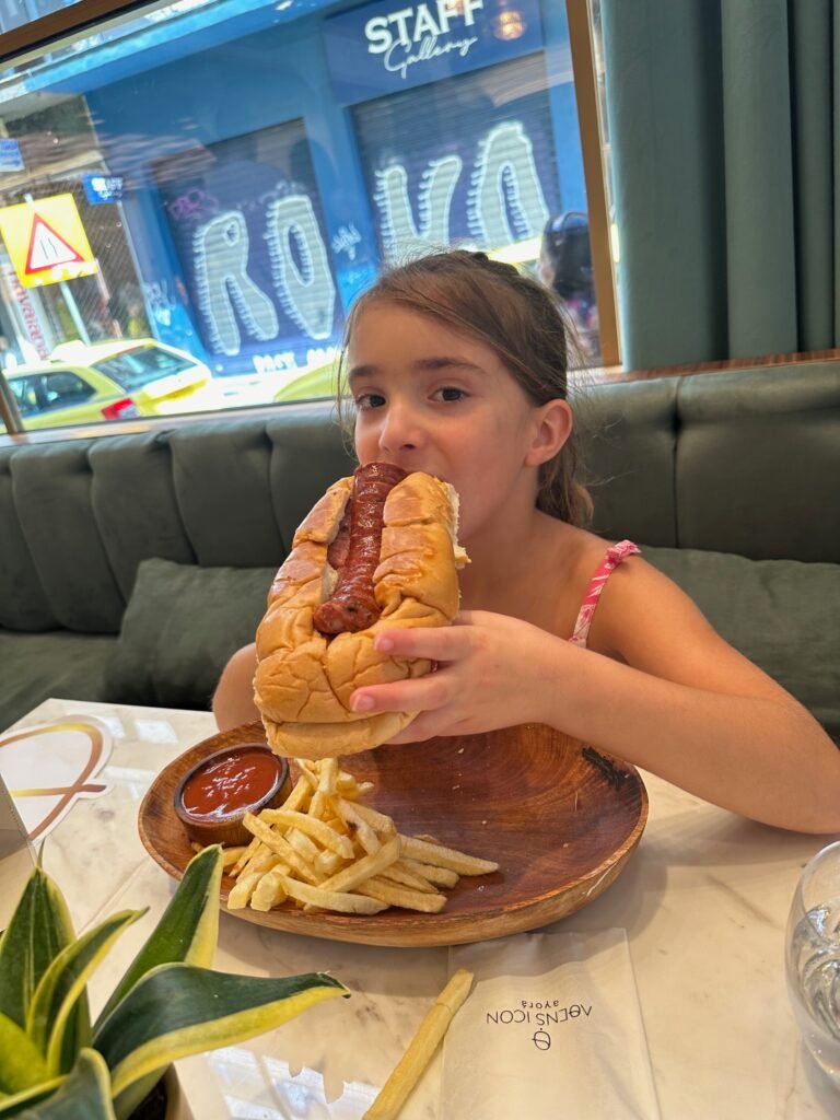 Where to eat cheap in Athens with kids — giant hot dog from Icon Ayora in Plaka
