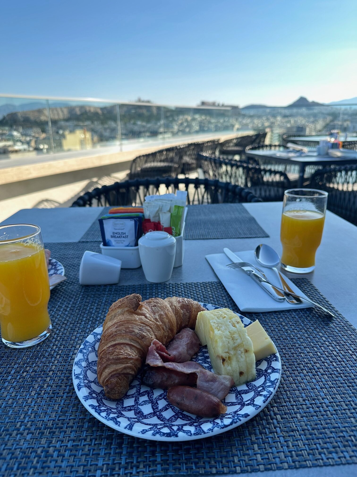 Rooftop breakfast at Grand Hyatt Athens with Acropolis view, highlighting affordable Greek vacation with points.