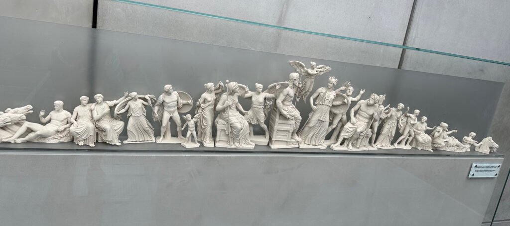 Miniature reproduction of the Parthenon frieze depicting scenes from ancient Greek mythology